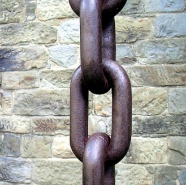 Chain in front of brick wall
