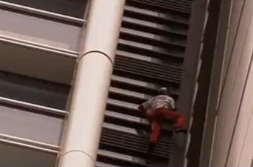 French Spidey Climbs Skyscraper
