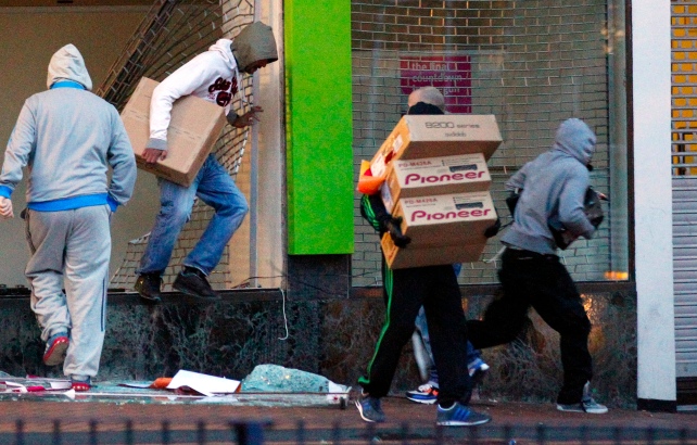 Rioters leaving warehouse.