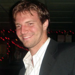 TOM E. GORDON