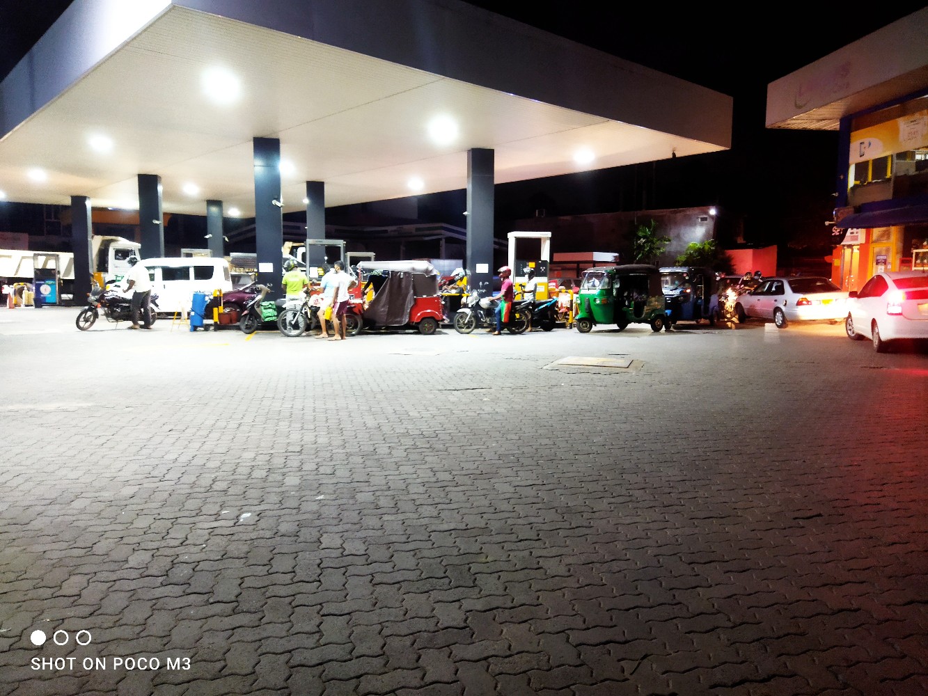 Motorists queue to purchase fuel before price hike sets in