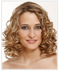 Model with medium length blonde highlighted curly hair