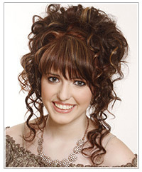 Model with brown highlighted curly hair