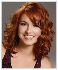 Model with long copper layered curls