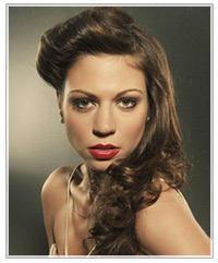 Model with half up half down curly hairstyle
