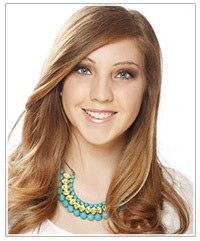 Model with a deep side part and long, loose hair