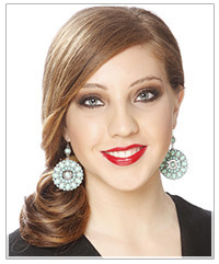 Model with a deep side part and a ponytail