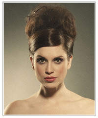 Model with a deep side part and an updo