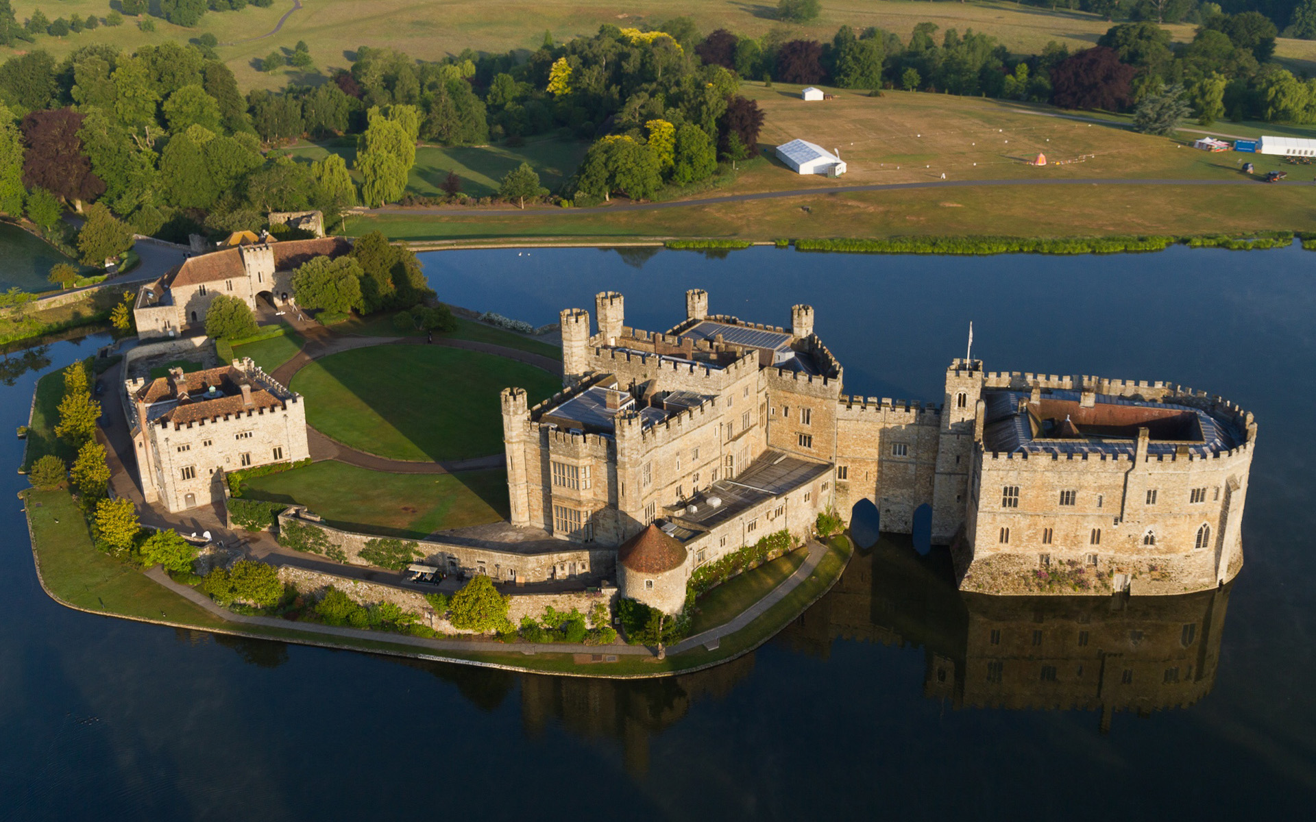 Leeds Castle with moat, Canterbury Cathedral, and Dover's White Cliffs on a London day trip.