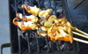 Ist2_2781083_hd1080_food_preparation_octopus_calamari_squid_skewers_on_charcoal_grill_thumb