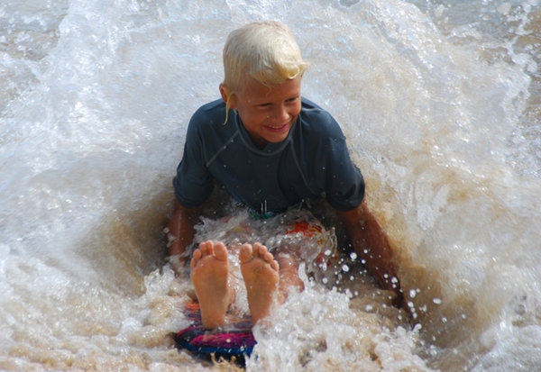 Kid playing in the water, Waikiki Beach, Hawaii Kid playing in the water, Waikiki Beach, Hawaii