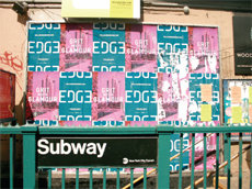 Pasting_up_signs_of_the_times_midsize