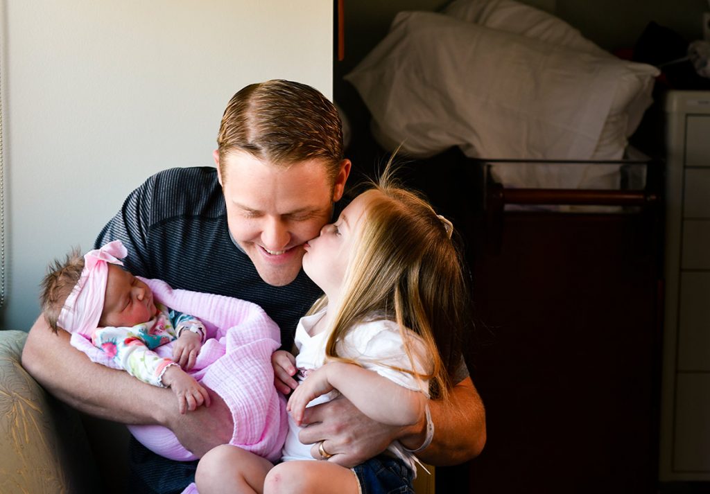 Doug Burford with his two daughters, Hadley and newborn, Eloise, the first baby born in Highlands Ranch