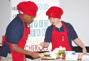 Two youth doing a baking demonstration