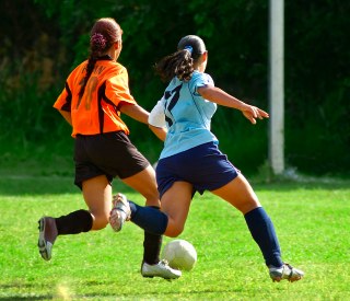 Teen-girls-playing-soccer