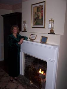 Web-3240751-karen_at_the_fireplace_in_our_room-natchez