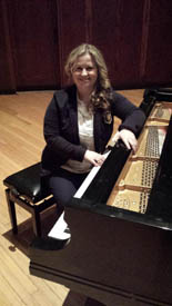 Lily Finikin
sitting at the piano