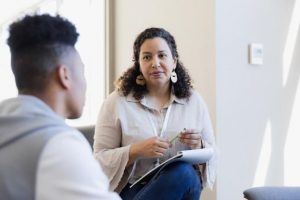 A counselor meets with a client.