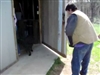 Kathy and Dr Sure bring pup's into barn at HR