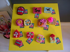 Knitted and needlepoint brooches