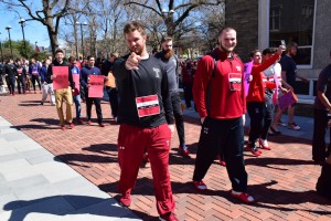 Temple men donned red high heels in support of females everywhere. The "Walk A Mile In Her Shoes" event took place right on Temple's campus to raise awareness about rape and sexual assault. (Photo credit: Eric White)