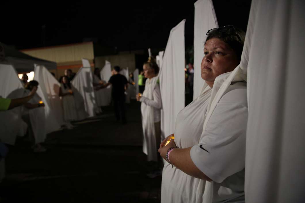 The Angels reprised their roles one year after the shooting at Pulse, protecting the club during an early morning vigil. Photo: Joey Roullette