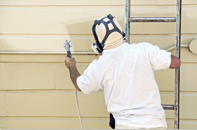istockphoto_10518983-man-on-ladder-painting-with-spray-gun Power Sprayer