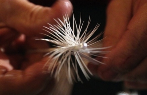 Artisan Dennis Bauer wraps a goose feather to make a traditional feather Christmas tree Feather Christmas Trees - Goose Feather