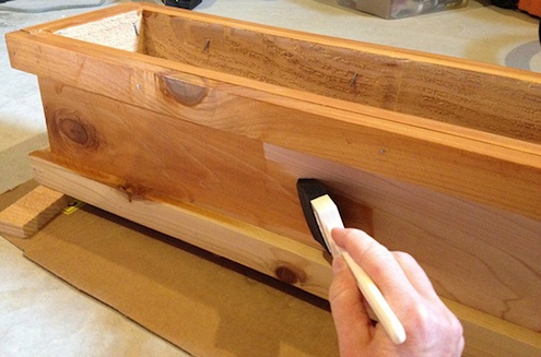 Finishing and Sealing the Deck Rail Planter. Photo: Flickr / jencelene