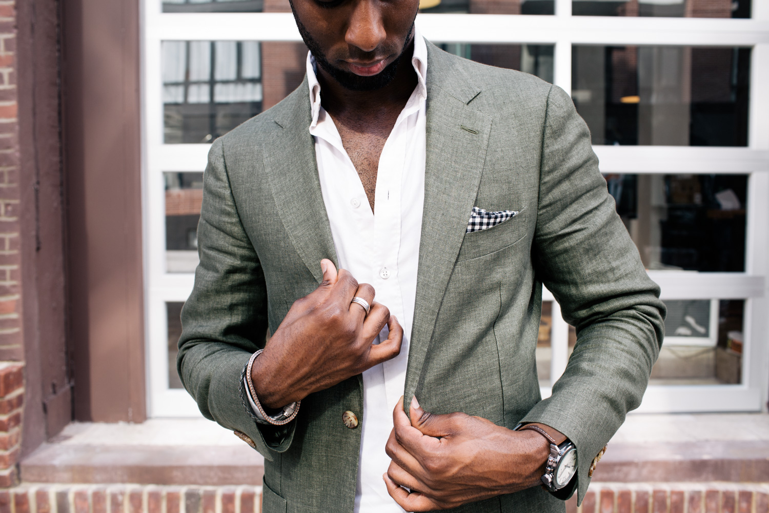 Wayne Wilson in a green jacket in the streets of Dumbo