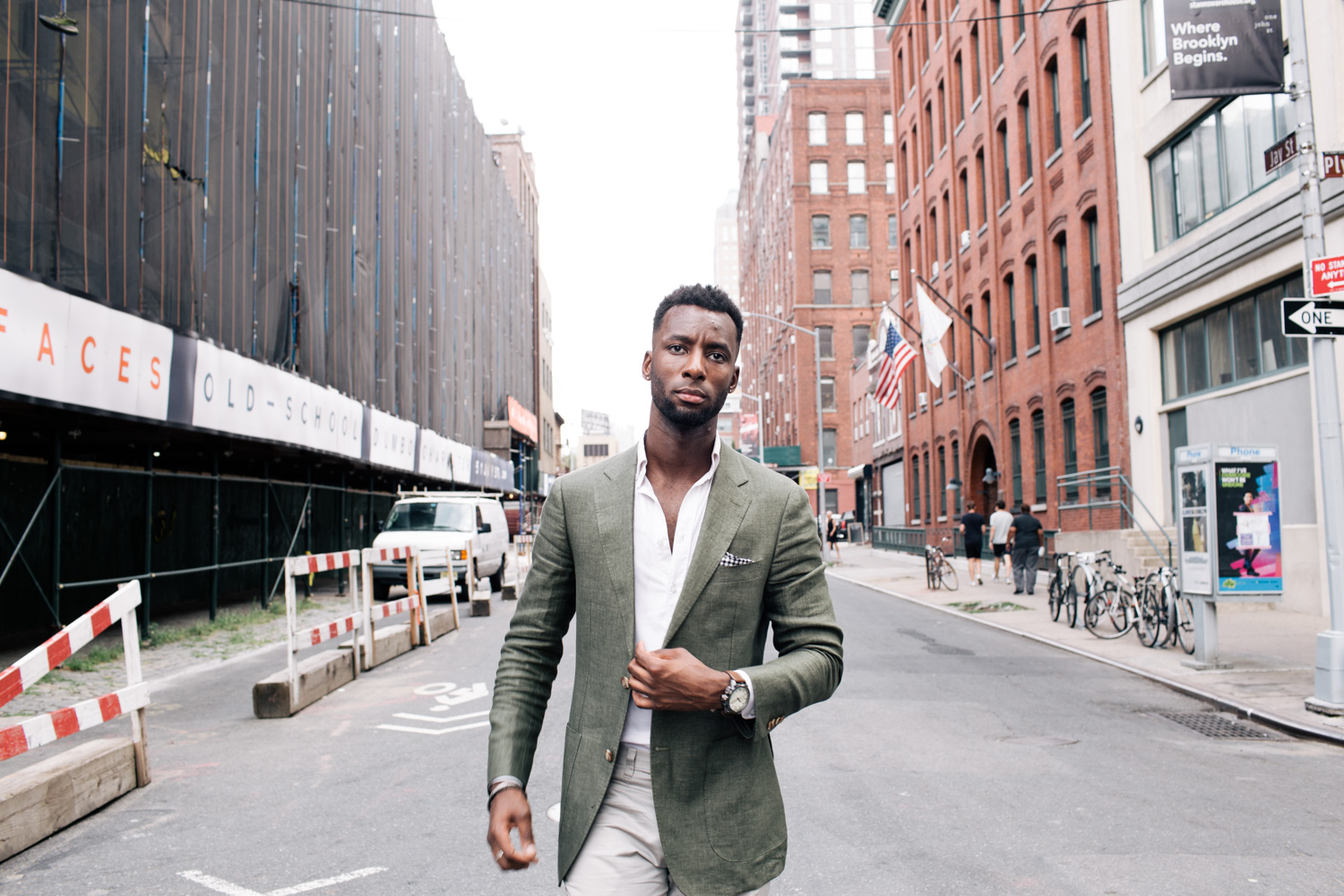 Wayne Wilson in a green jacket in the streets of Dumbo