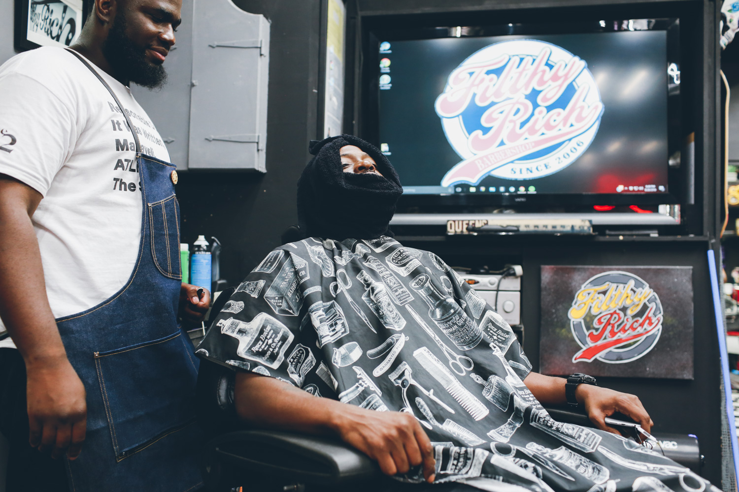 Jungle getting a cut in Filthy Rich Barbershop