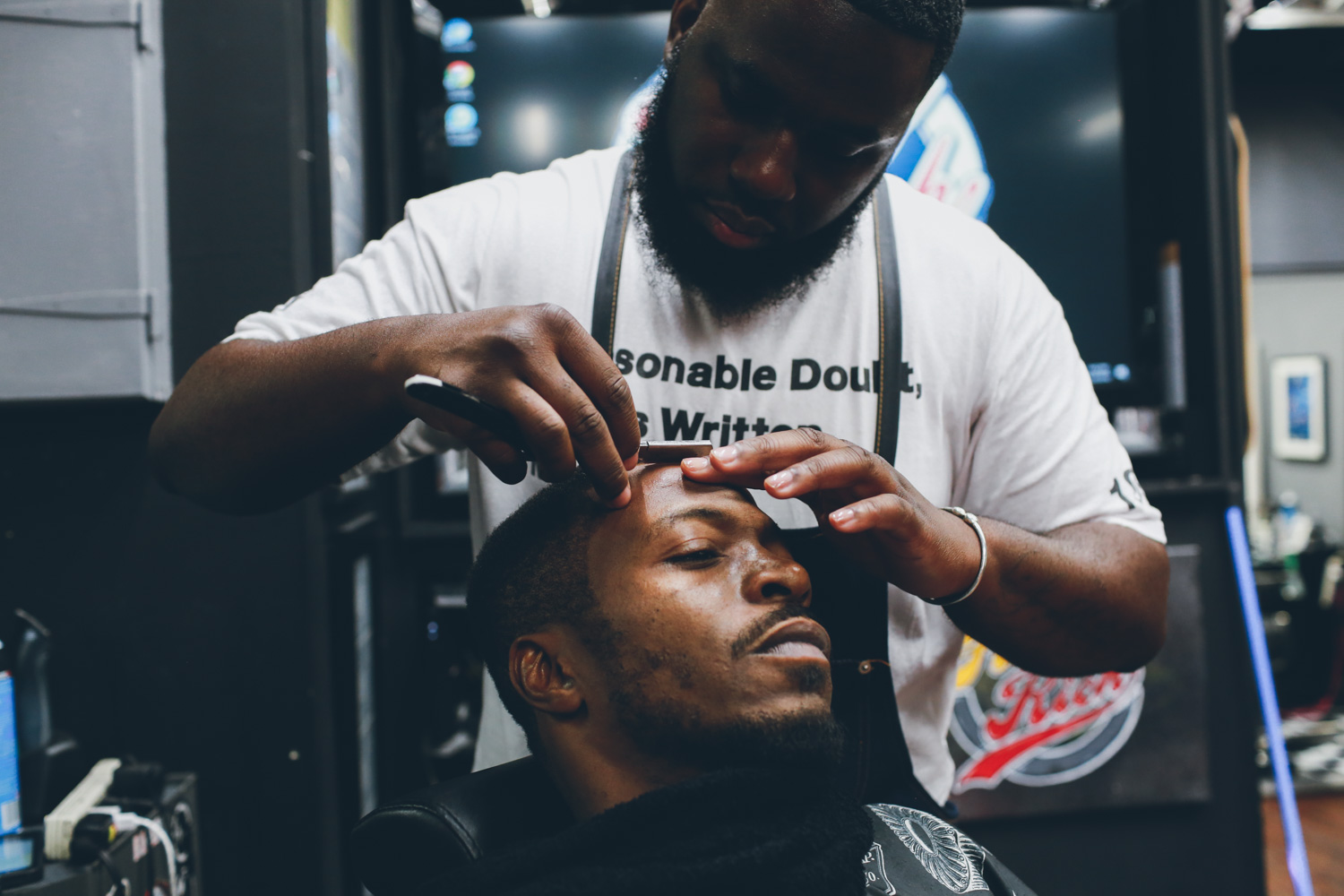 Jungle getting a cut in Filthy Rich Barbershop
