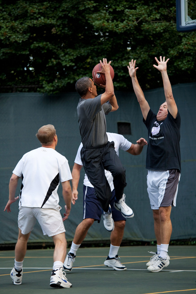 President Barack Obama takes a shot during a game with Cabinet Secretaries and Members of Congress on the White House basketball court, Oct. 8, 2009. (Official White House Photo by Pete Souza) This official White House photograph is being made available only for publication by news organizations and/or for personal use printing by the subject(s) of the photograph. The photograph may not be manipulated in any way and may not be used in commercial or political materials, advertisements, emails, products, promotions that in any way suggests approval or endorsement of the President, the First Family, or the White House.