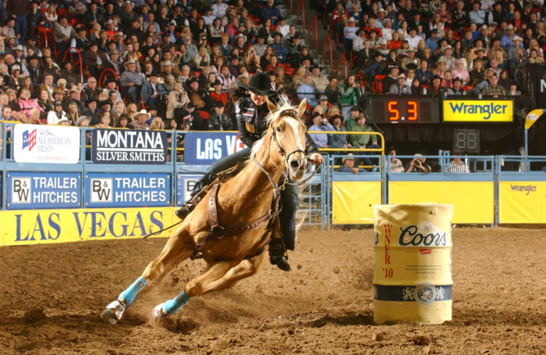 brittany pozzi and duke running barrels at NFR