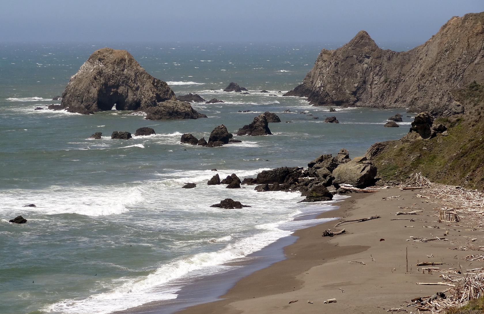 Hiway 1 rises up the jagged cliffs, but this is well before the heights of the Dramamine Hiway.