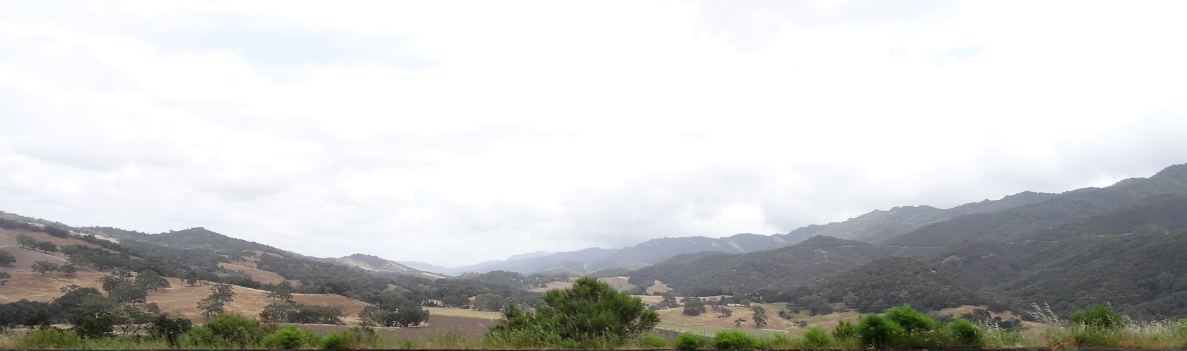 Hazey, oak filled valleys wind their way through the mountains making vast farmlands. Eventually you will reach the Central Valley.
