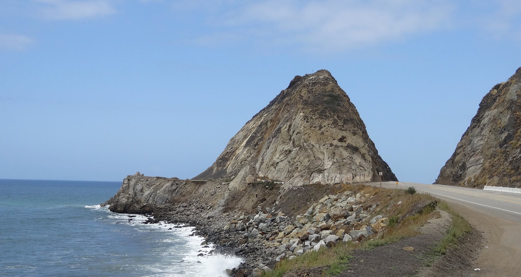 Point Magu Rock is a funny place. I don't know why they cut through it instead of knocking it into the ocean when they built Hiway 1. Now it is one of the most recognizable features of the So Cal coast. I climbed it one morning at 5am when the warm Santana Winds were blowing, to watch the patterns of the sunrise on the ocean. I decided later that it is a surprisingly dangerous place to climb, because the rocks crumble easily.