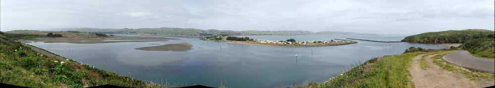 A calm bay leading to a rough sea
