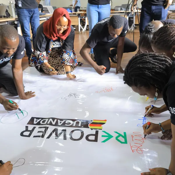 Group gathered round a banner
