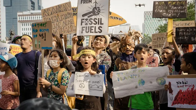 Activists march for an end to fossil fuels.