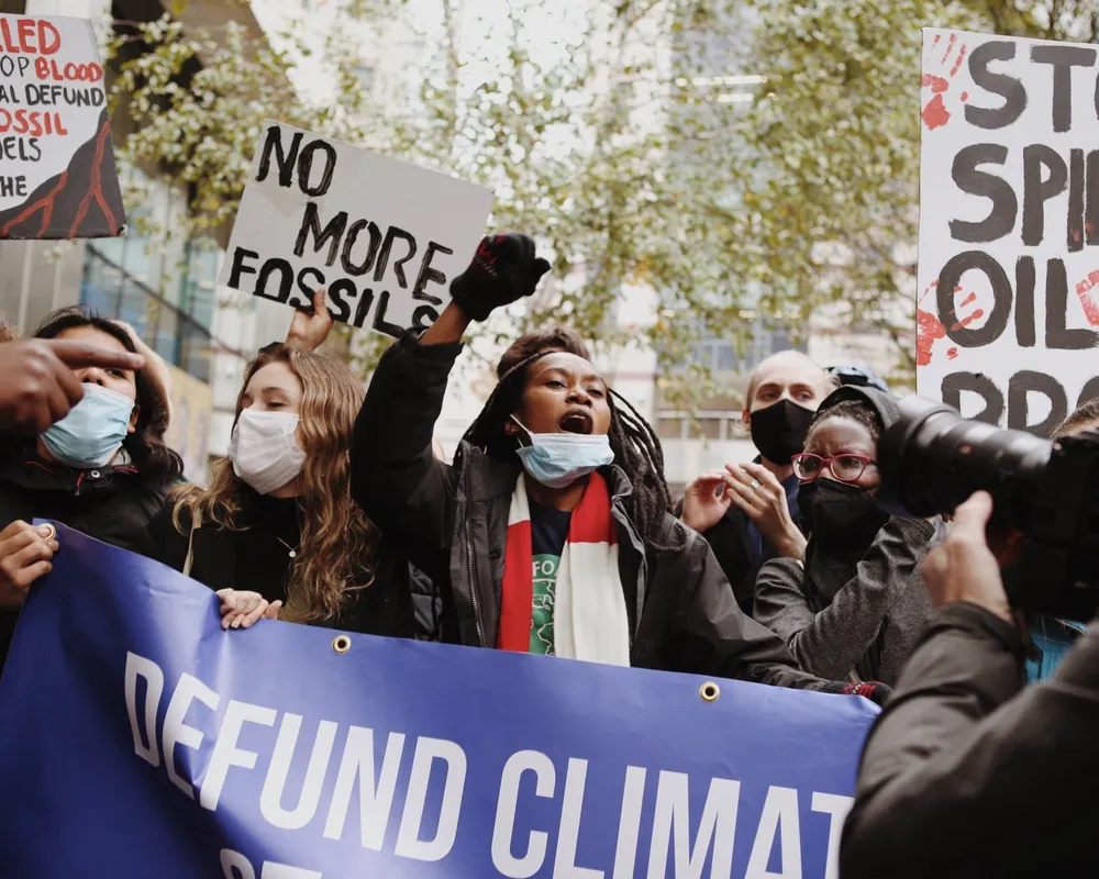 Young people protesting against fossil finance outside Standard Chartered Bank.