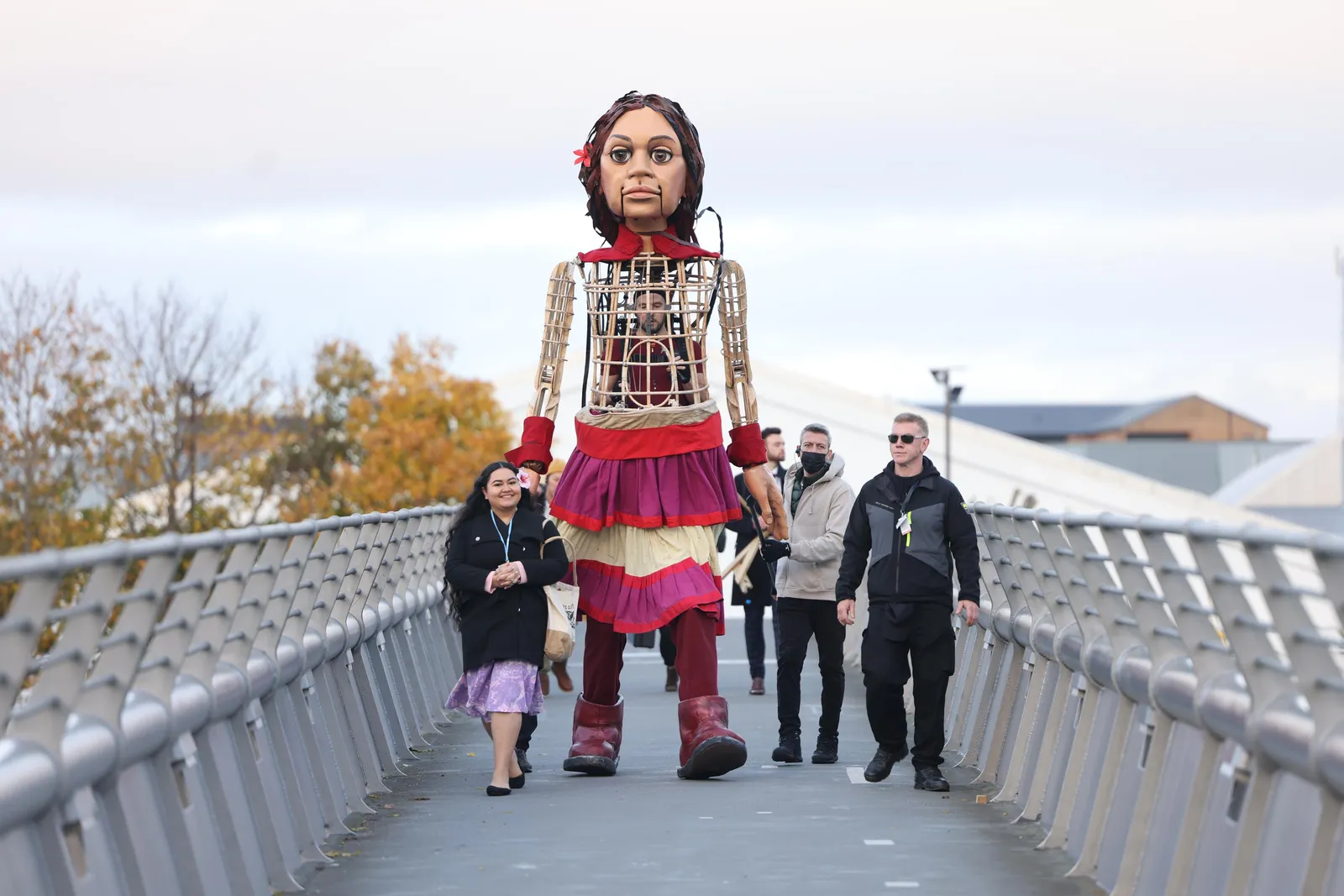 Little Amal and Pacific Climate Warrior Brianna Fruean approach COP26 in Glasgow.