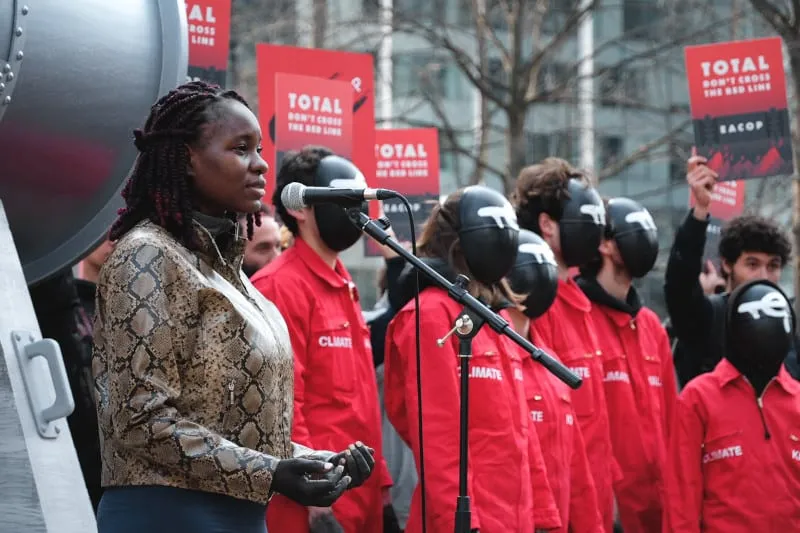 As part of the StopEACOP European tour organized by 350.org, activists from Uganda protest EACOP in front of the TotalEnergies headquarters, La Defense, France. Photo: Léa Garson