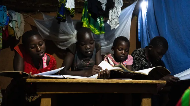 Children read at night thanks to the newly installed solar system.