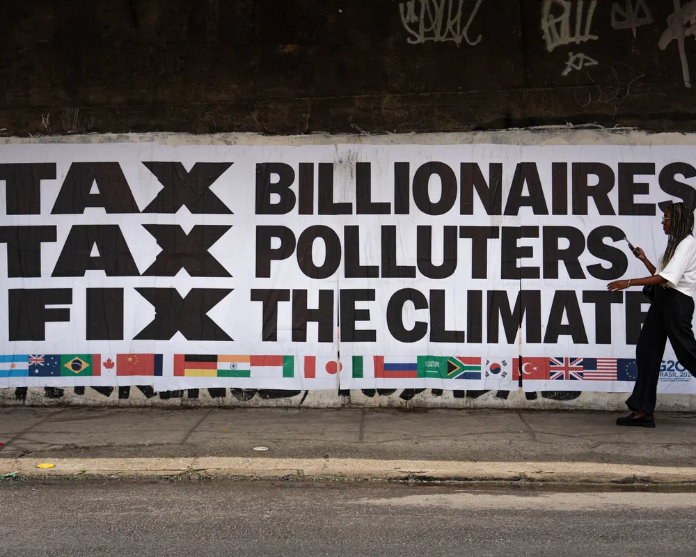 Big sign showing: G20 Tax their Billions banner in Rio, Brazil