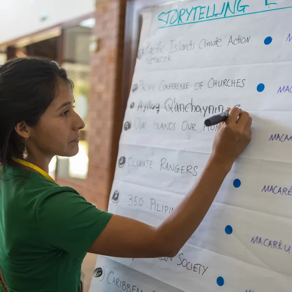 Activist signs up to participate in storytelling session.