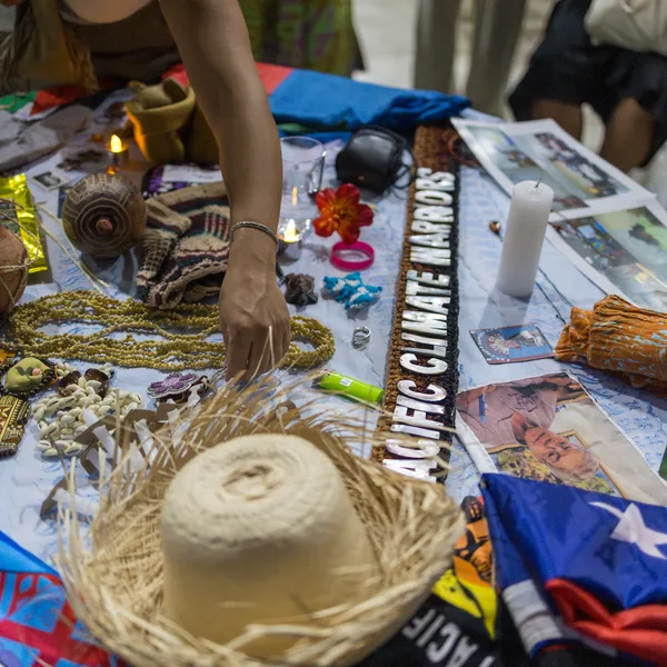 Table displaying handmade crafts belonging to activist participants at the gathering.