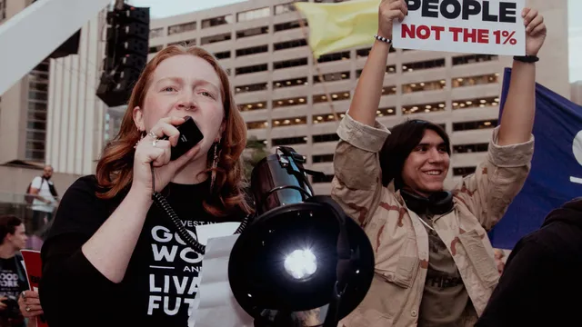 A protestor speaking into a megaphone