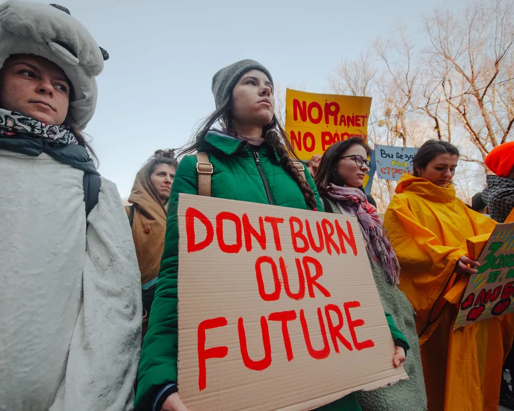 Youth Climate Strikers in the Ukraine carrying signs with climate slogans.